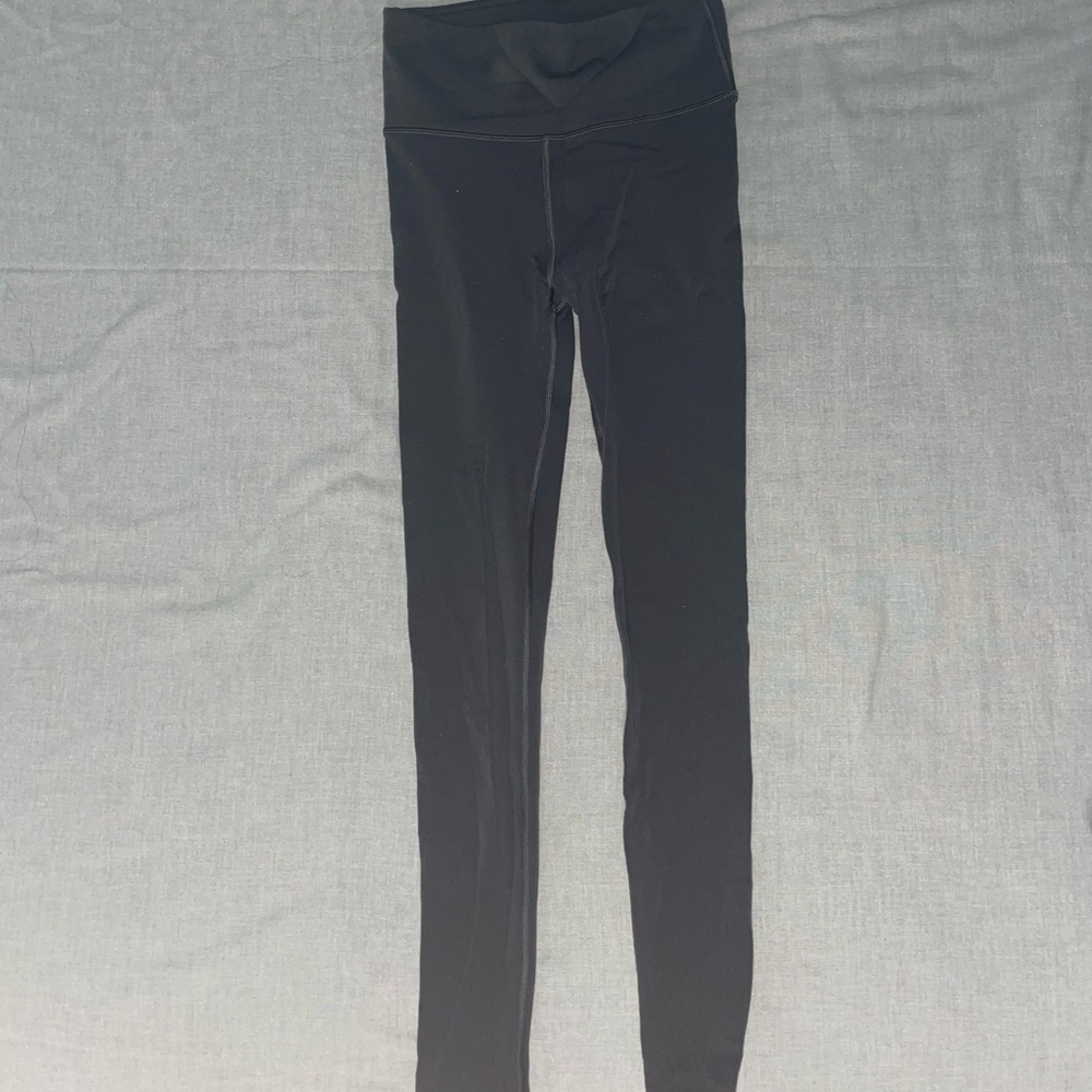 Dark grey lululemon leggings with hole pattern